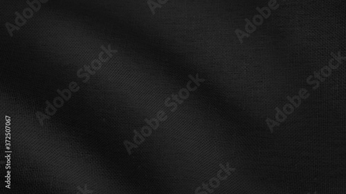 close up black ripple fabric background. smooth linen fabric texture with space for text.