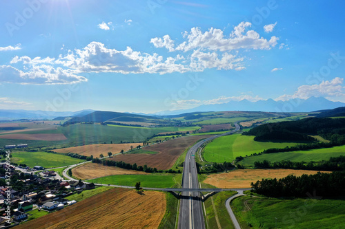 Aerial view of the highway and a view of the Tatras in the village of Spissky Stvrtok in Slovakia