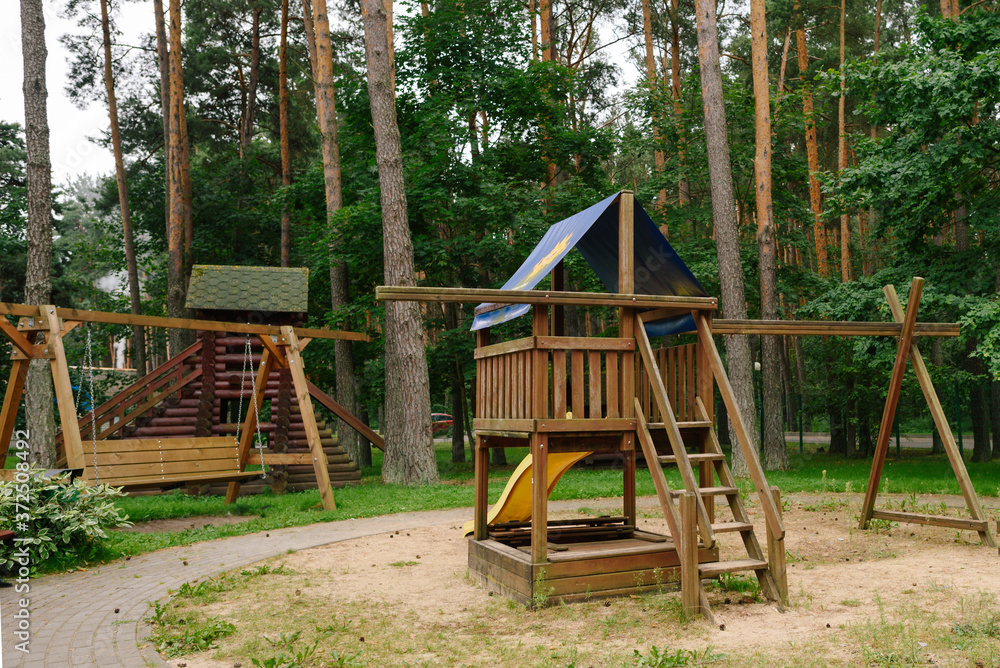 Children's playground. A children's slide made of wood and natural materials. Children's playground. A children's slide made of wood and natural materials.
