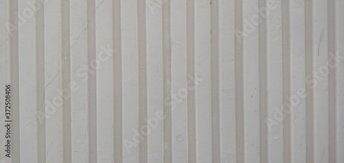 White walls_backgrounds with long vertical lines with embossing