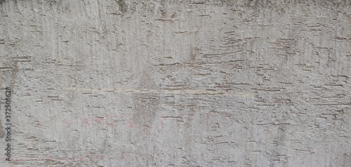 Rough gray wall with roller marks_background