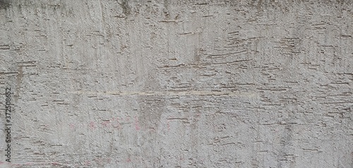 Rough gray wall with roller marks_background