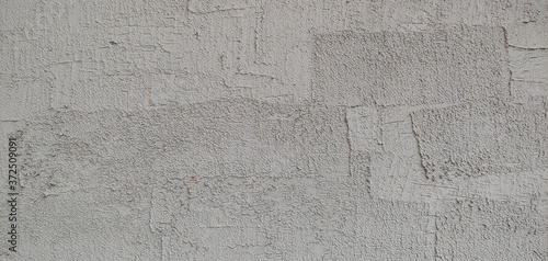 a grey wall with clear brush marks_background