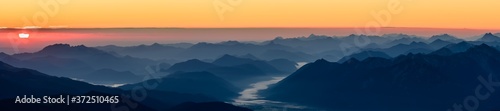 A beautiful and colorful sunrise on the summit of the highest mountain in Germany  Zugspitze at 2962m. 
