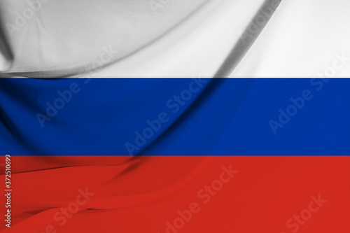 The national flag of Russia on fabric texture background. Flag image for design on flyers, advertising. © Lukas