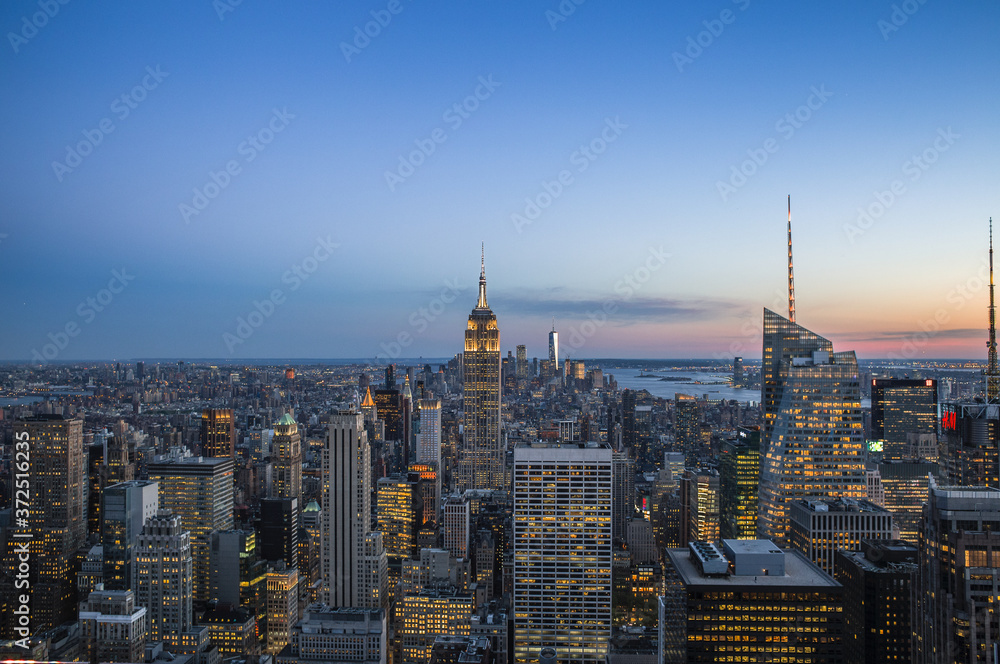 New York skyline at sunset with city lights