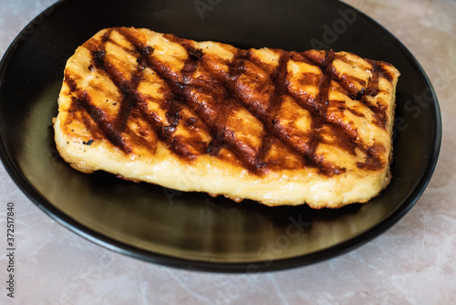 Grilled haloumi cheese on a plate