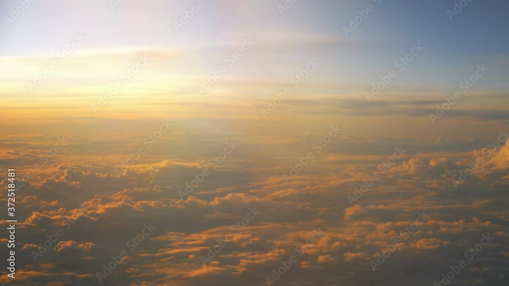 Sunset above the clouds during flight in 4K Sunset above the clouds during flight in 4K