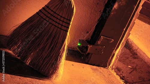 Broom in  garage with cool lighting