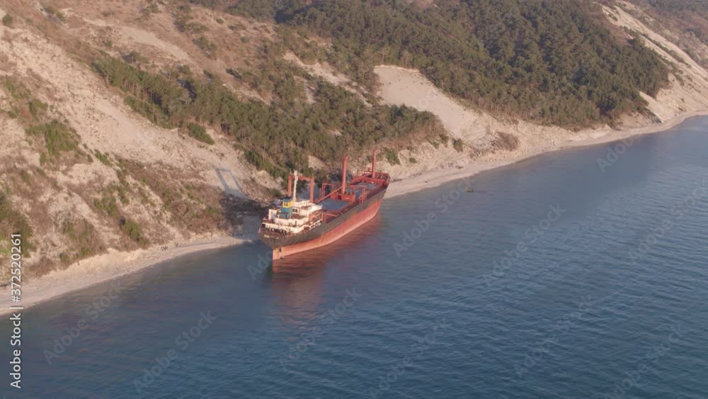 The ship ran aground. Environmental pollution at sea. Aerial view. grounded ship. Drone footage The ship ran aground. Environmental pollution at sea. Aerial view. grounded ship. Drone footage