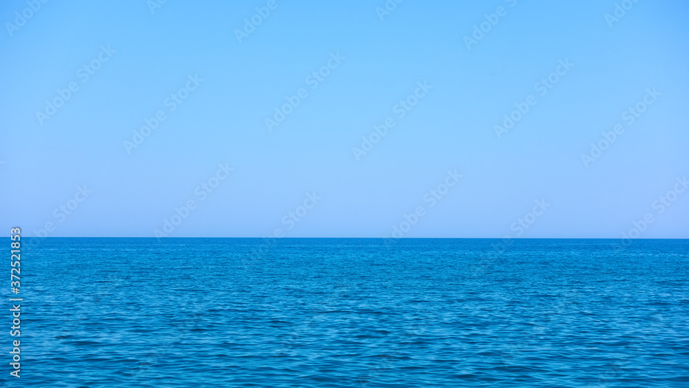 Sea horizon and blue serene sky