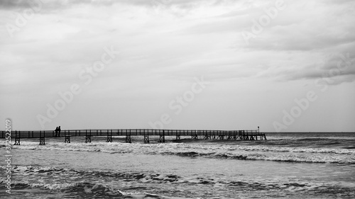 Seascape with the sea and long pier