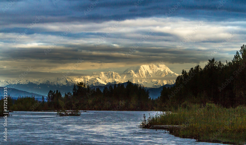 Early morning shot of Mt Denali (Mt McKinley) and the Alaska Range, and the Susitna River in Alaska near Talkeetna.
