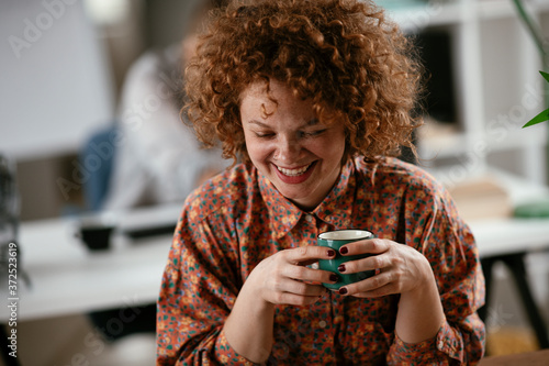 Beautiful businesswoman working on projects. Young businesswoman drinking coffee in the office.