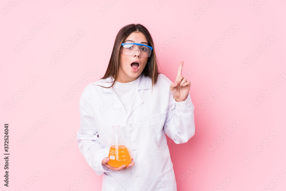 Young chemical woman isolated having an idea, inspiration concept. Young chemical woman isolated having an idea, inspiration concept.