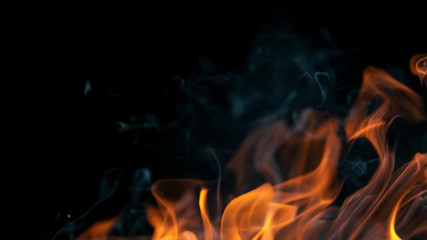 fire flames with sparks on a black background, close-up