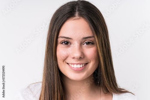 Young pretty caucasian woman face closeup isolated © Asier