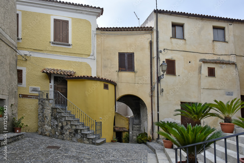 A narrow street among the old houses of Scalea, a rural village in the Calabria region, Italy.