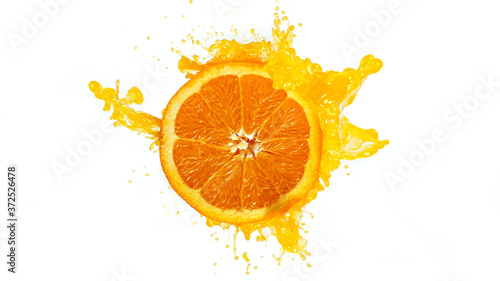 Fresh Orange Slice with Splashing Juice Isolated on White Background.