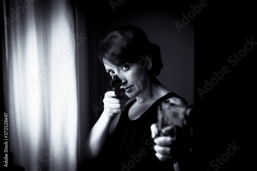 Portrait of woman with gun