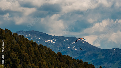 Beautiful alpine view with a paraglider at the famous Zillertaler Hoehenstrasse, Tyrol, Austria