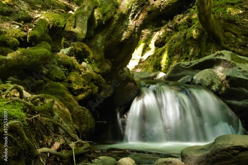  romantic place in the forest with a small waterfall