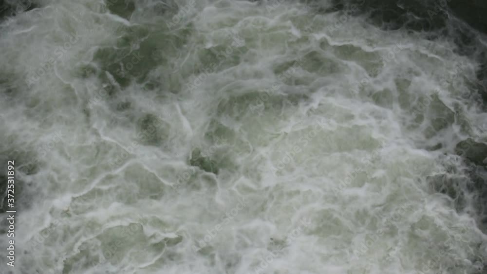 Close up of water stream with white and transparent bubbles. Mountain river. Close up of water stream with white and transparent bubbles. Mountain river.
