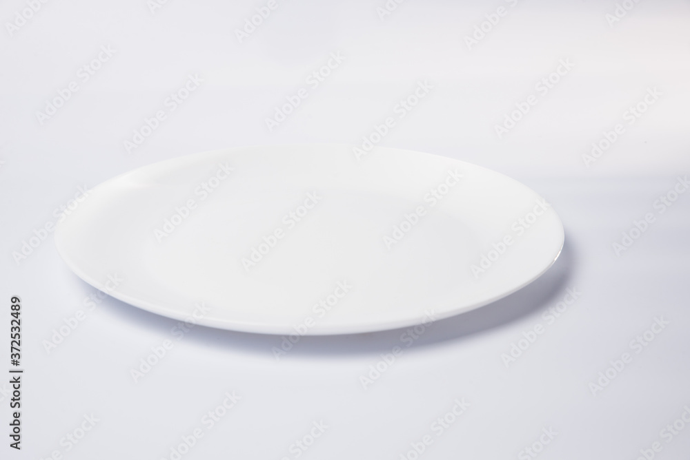 empty plate on a white background empty plate on a white background