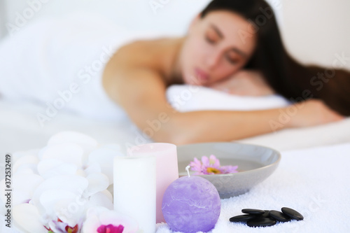 composition of spa candles and white towels