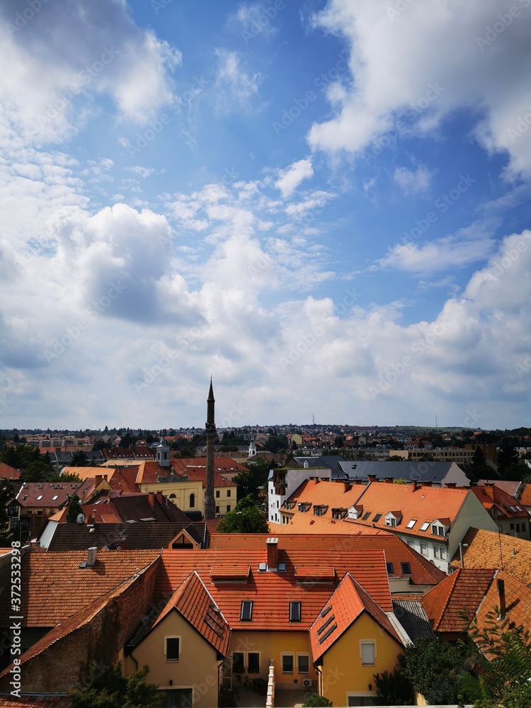 Rows of houses and buildings in Eger, and the beautiful blue sky