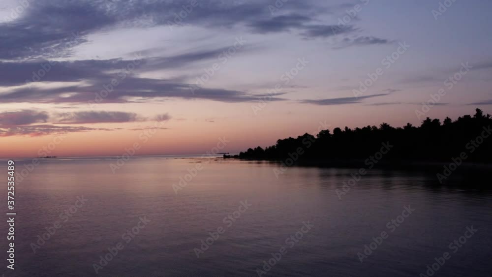 Pulling Away From Coast at Sunrise over Great Lake Aerial. Depart land, rising Pulling Away From Coast at Sunrise over Great Lake Aerial. Depart land, rising