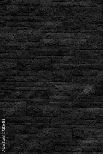 Black brick building wall. Interior of a modern loft. Background for design