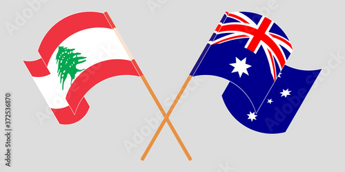 Crossed and waving flags of Lebanon and Australia