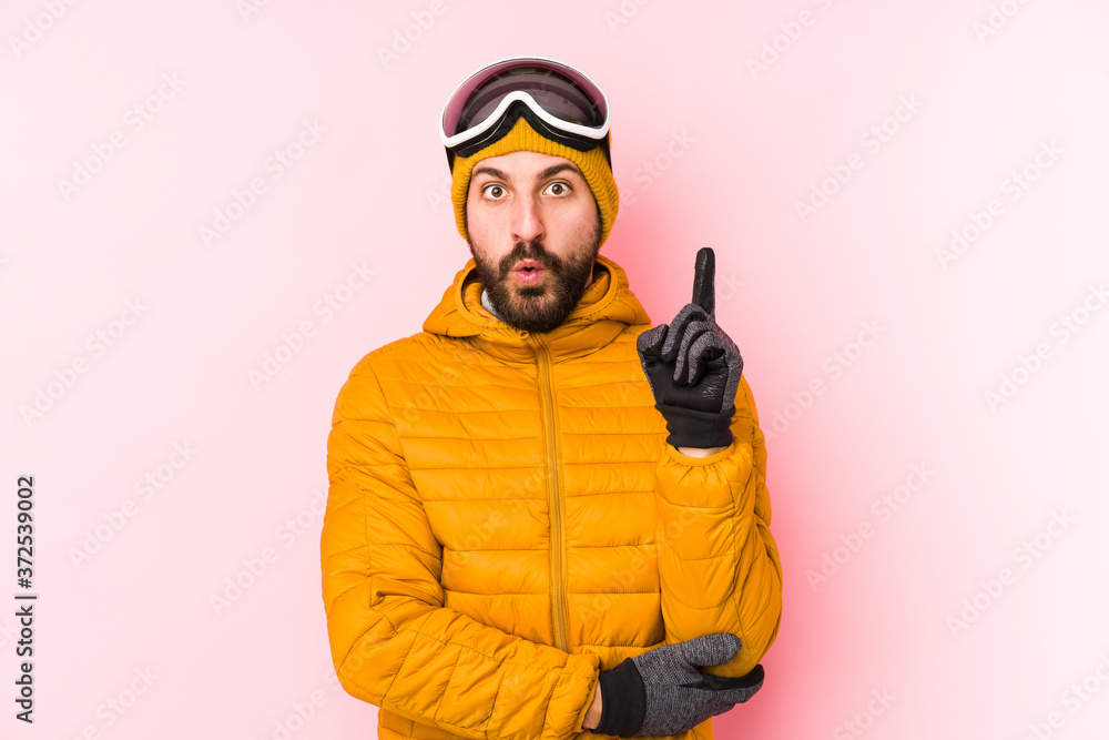 Young skier man isolated having some great idea, concept of creativity. Young skier man isolated having some great idea, concept of creativity.