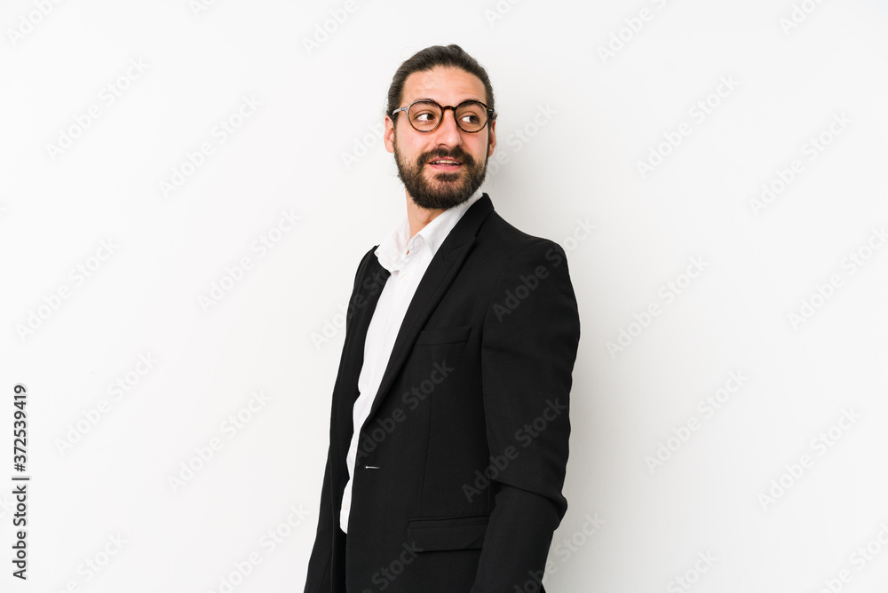 Young caucasian business man isolated on a white background looks aside smiling, cheerful and pleasant. Young caucasian business man isolated on a white background looks aside smiling, cheerful and pleasant.