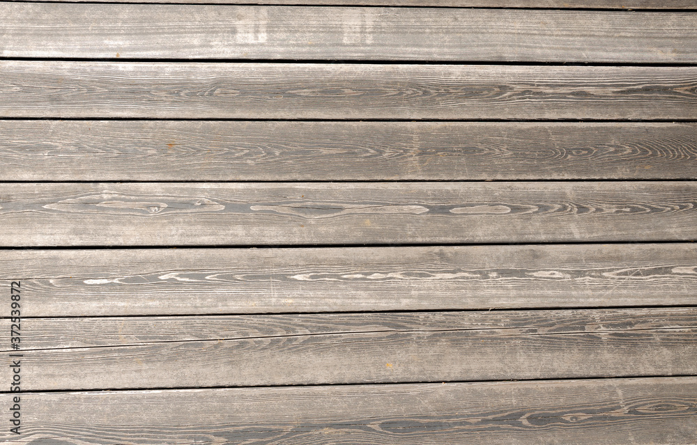 Obraz premium The background is made of grey wooden planks.