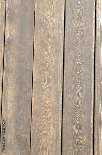 The background is made of grey wooden planks, vertical. 1