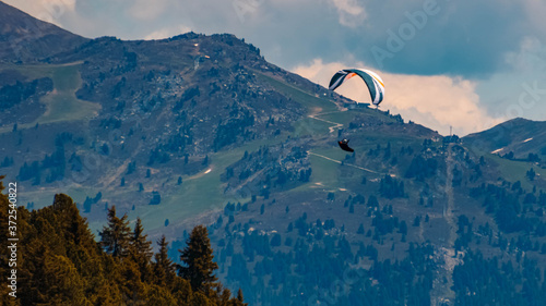 Beautiful alpine view with a paraglider at the famous Zillertaler Hoehenstrasse, Tyrol, Austria