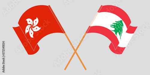 Crossed and waving flags of Lebanon and Hong Kong