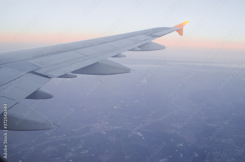 Landscape from the cockpit of an airplane in the evening light Landscape from the cockpit of an airplane in the evening light