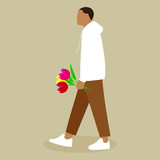 A man carries a bouquet of flowers