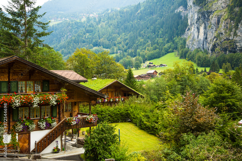 Lauterbrunnen, Switzerland;  Swiss chalets in the Laturbrennen valley.