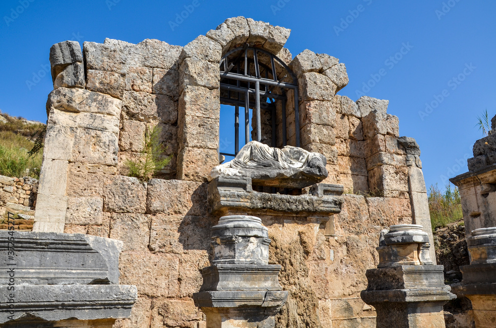 Nymphaeum Fountain with the statue of Kestros the river goddess at ancient Greek city in Perge and the capital of Pamphylia, near Antalya, Turkey Nymphaeum Fountain with the statue of Kestros the river goddess at ancient Greek city in Perge and the capital of Pamphylia, near Antalya, Turkey