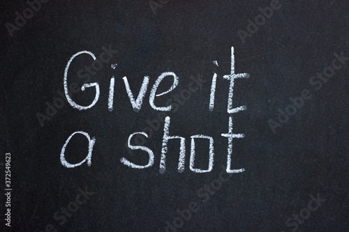 Lettering on a chalkboard Give it a shot. Encouraging inscription