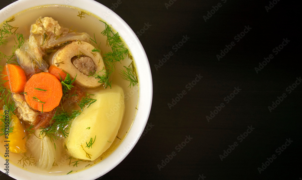 Shurpa soup in a white bowl on dark wooden background with copy space. Top view. Famous traditional Asian, Uzbek, Middle East soup with beef or lamb and vegetables. Shorpa, sherpa, chorba Shurpa soup in a white bowl on dark wooden background with copy space. Top view. Famous traditional Asian, Uzbek, Middle East soup with beef or lamb and vegetables. Shorpa, sherpa, chorba