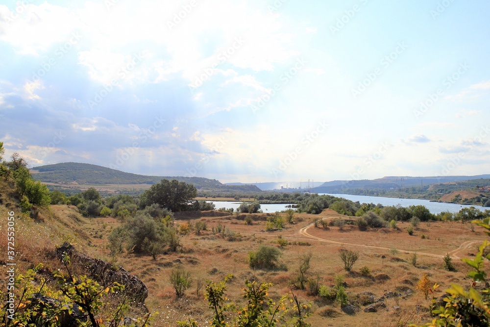 View from the height of the meadow and lake in the vicinity of the village of Strashimirovo (Bulgaria)