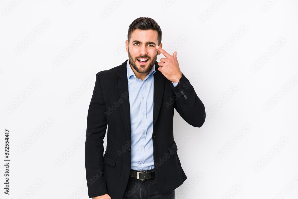 Young caucasian business man against a white background isolated showing a disappointment gesture with forefinger. Young caucasian business man against a white background isolated showing a disappointment gesture with forefinger.