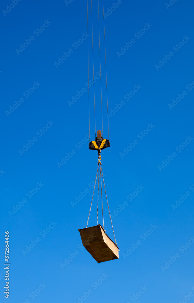 Cargo hoisted by ropes to the sky Cargo hoisted by ropes to the sky