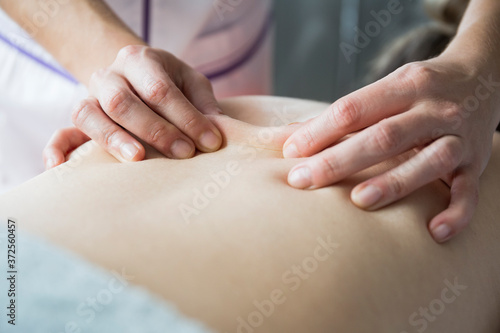 Wallpaper Mural Hands of female physiotherapist massaging the back of a woman Torontodigital.ca