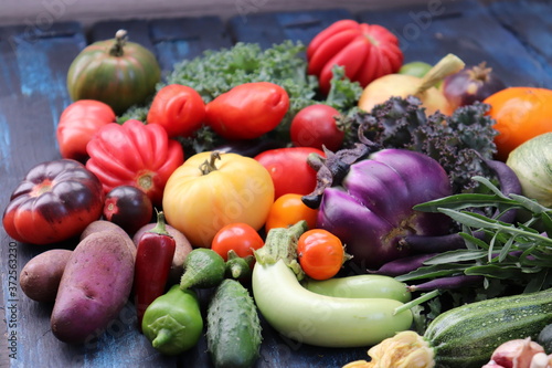 Multicolored vegetables on a dark wooden background  selective focus.